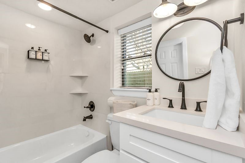 Bathroom stocked with shampoo, conditioner, shower gel, lotion and handsoap