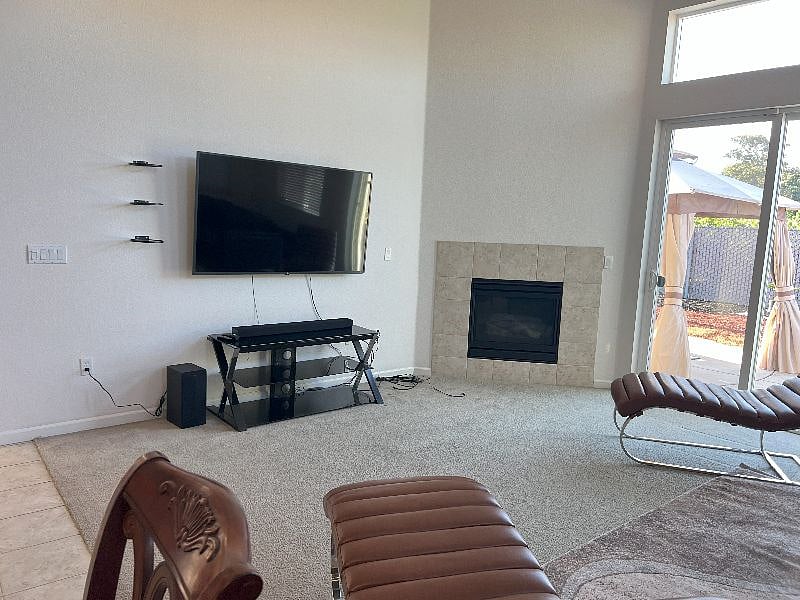65in LED TV entertainment with LG soundbar and subwoofer