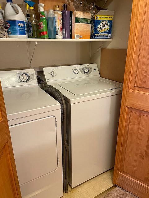 Full-sized washer and dryer upstairs near bedroom.