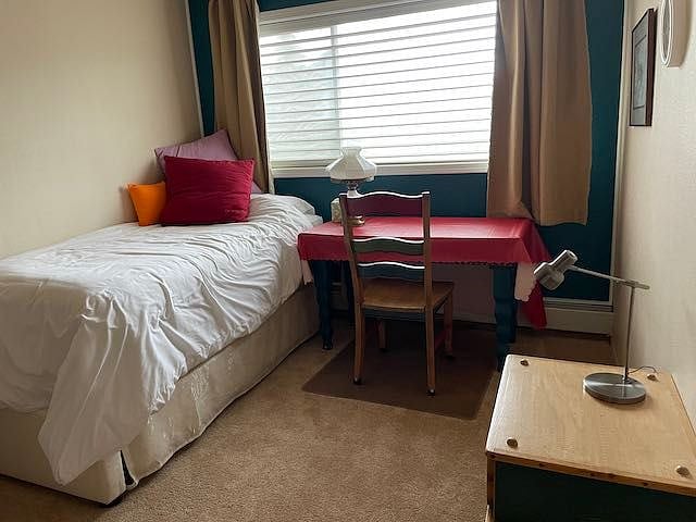 Adjacent room has a large desk with pull-out tray for laptops or keyboards available for renter.