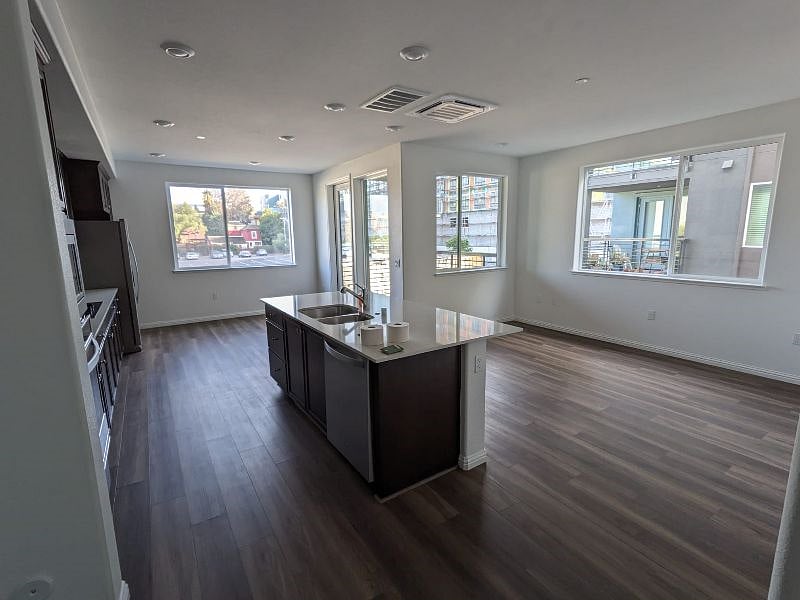 kitchen, dining, balcony and living room.
