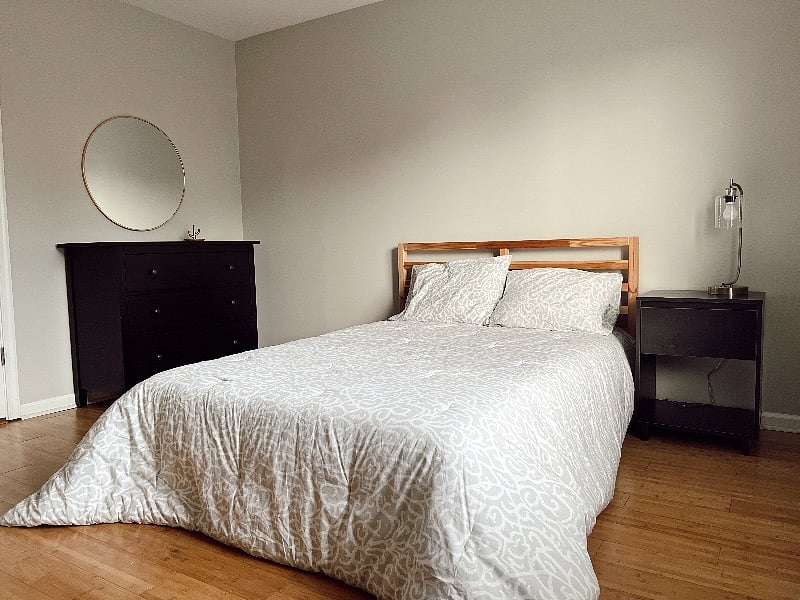 Bedroom 2 also has a chest of drawers for clothing and storage.