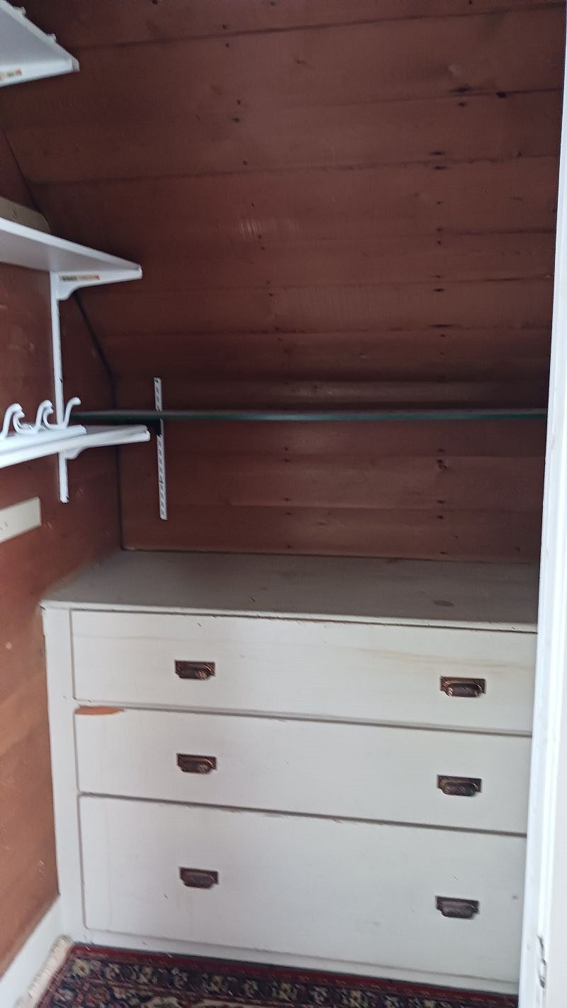 Hallway closet for cleaning supplies and extra storage