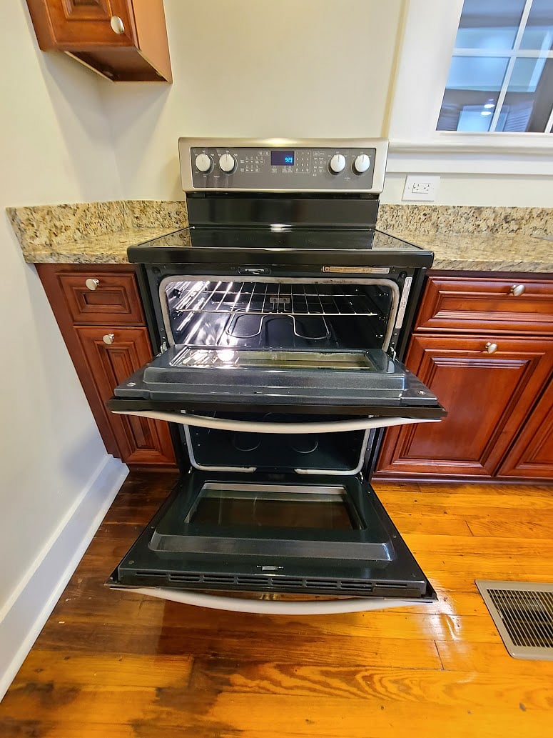 Electric stove w/ double oven.