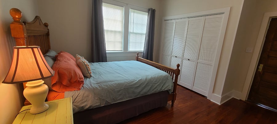 Queen bedroom with large closet with bi-fold doors.