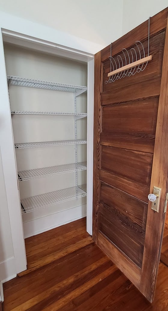 Dining room closet with adjustable shelving.