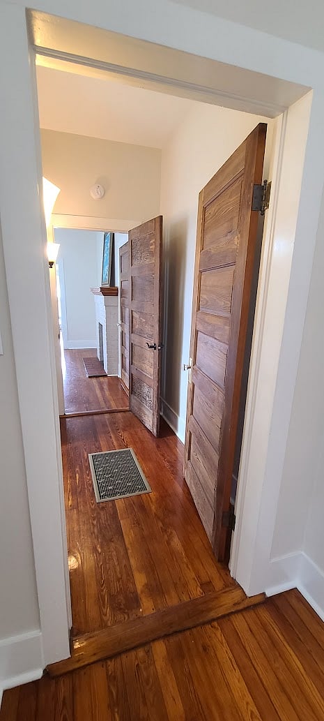 Hallway connecting the dining room and queen bedroom.
Bathroom is off the hallway to the left in this picture.