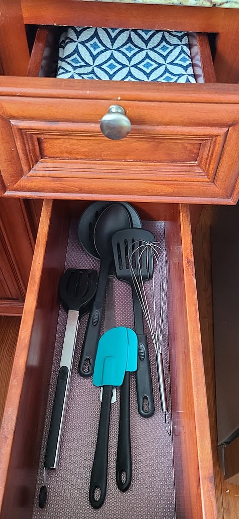 Dish towels and cooking utensils.