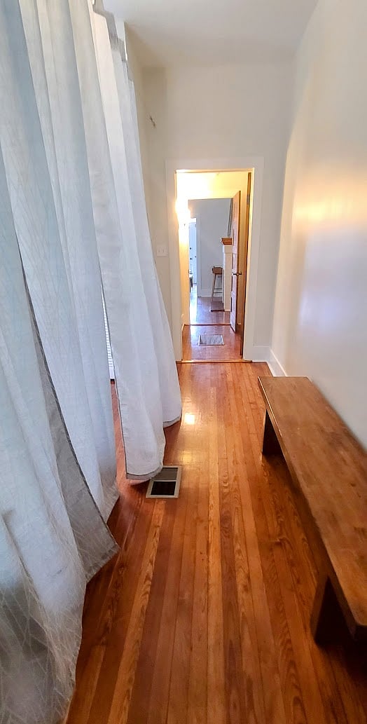 Moveable curtain creates visual privacy in Queen Bedroom.
