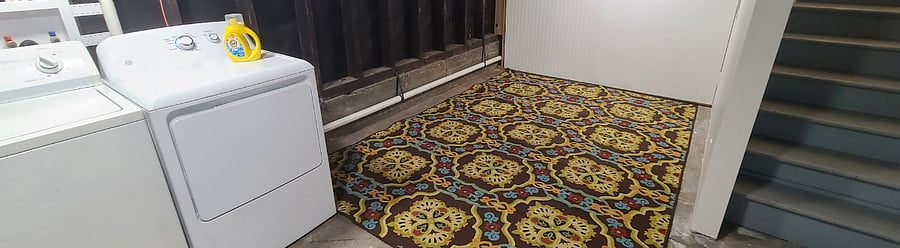 1st floor private laundry/storage room. Accessible via interior stairwell.