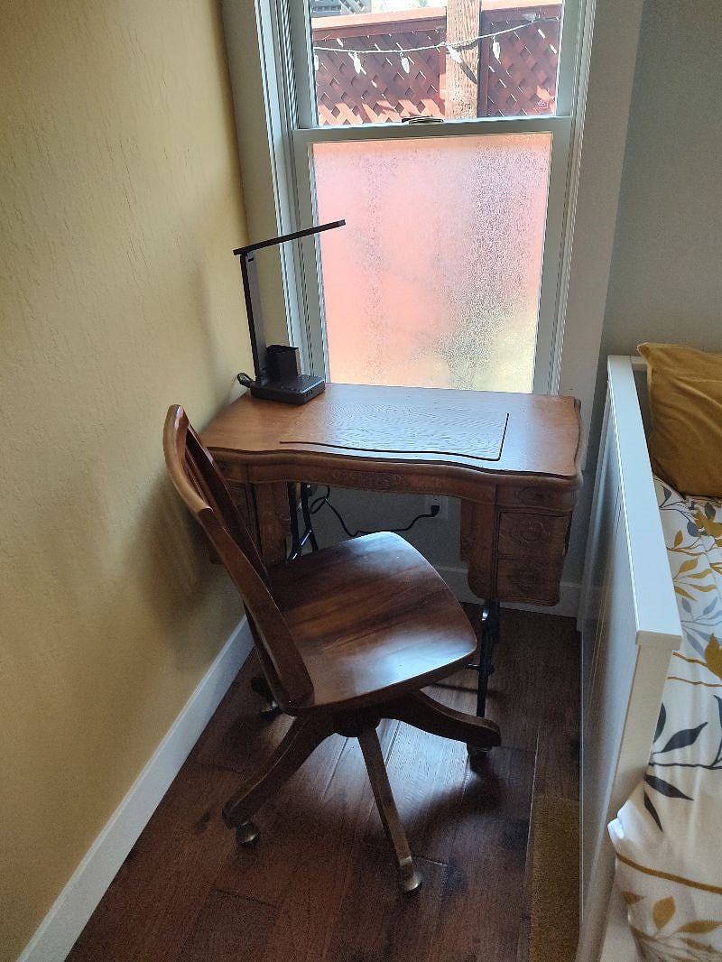 Desk with lamp.   Desk was created from a vintage sewing machine table.   The drawers on both sides open...even the top ones.   I will show you how to open the top ones!   Clever design inspires!