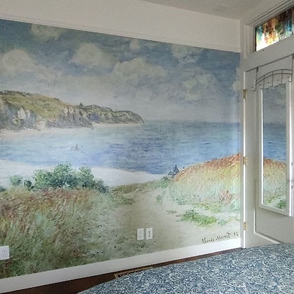 Claude Monet wall mural in master bedroom gives a calming atmosphere to the room.    Waking up on the beach!
