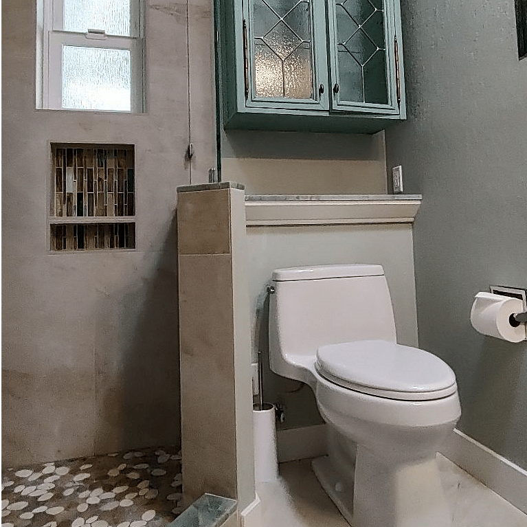 Guest bath.   Space for storage.  Outlets in medicine cabinet.   Medicine cabinet has interior lights, mirror that defogs, etc.