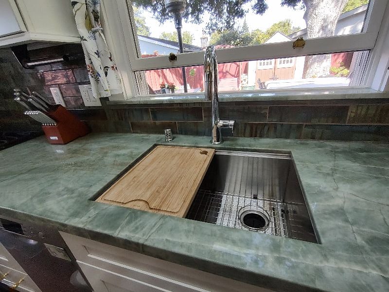 Sink with low guage tub for quietness.