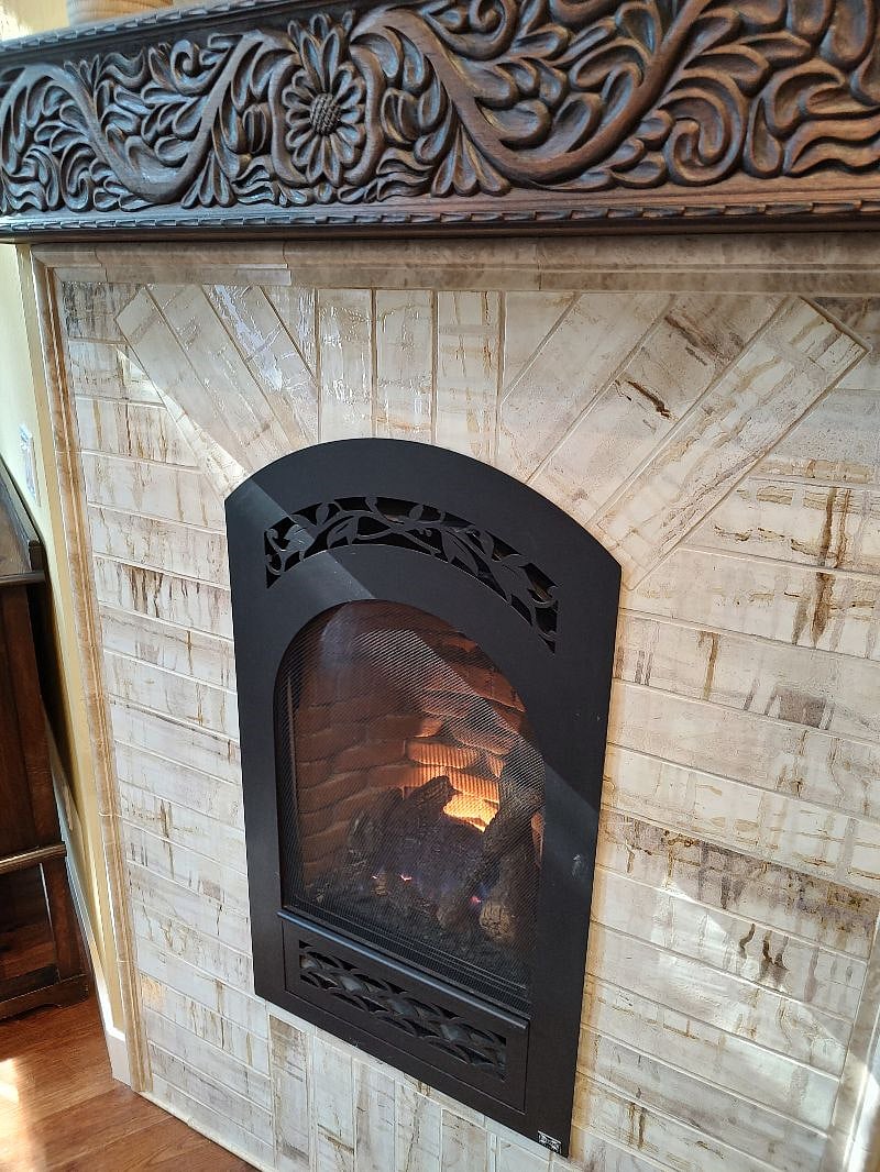 Gas fireplace with controller.   Great on rainy days!