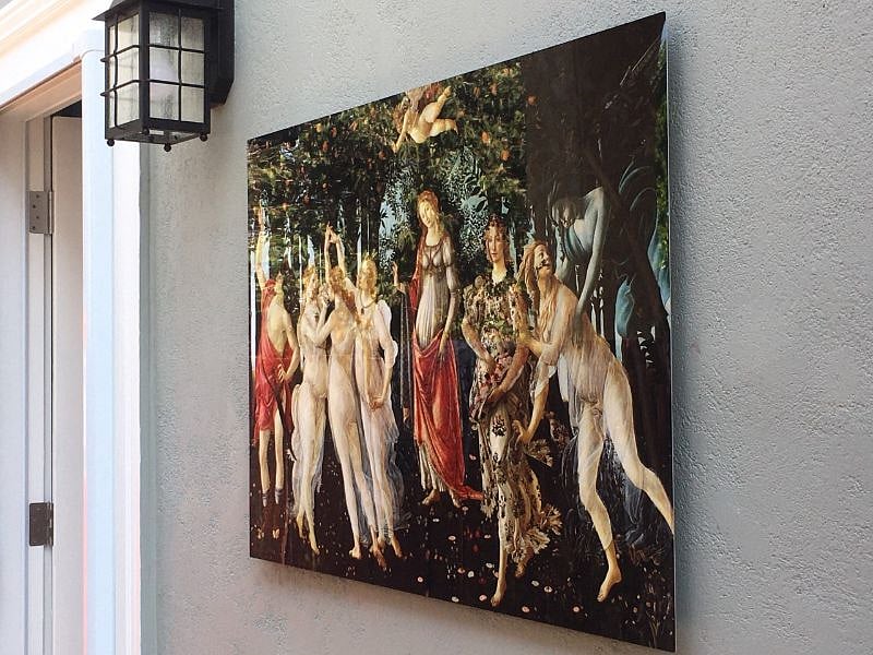 Art is displayed along the walkway to your cottage.    Botticelli's Primavera is featured here. 