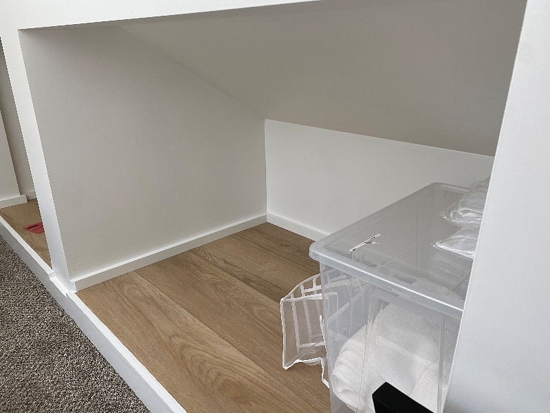Cubby and extra linens in bedroom