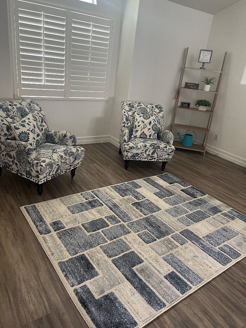 This is the living room. Great area to sit alone and read a book. There is a bar table with wine and champagne glasses to enjoy a glass of wine or champagne.