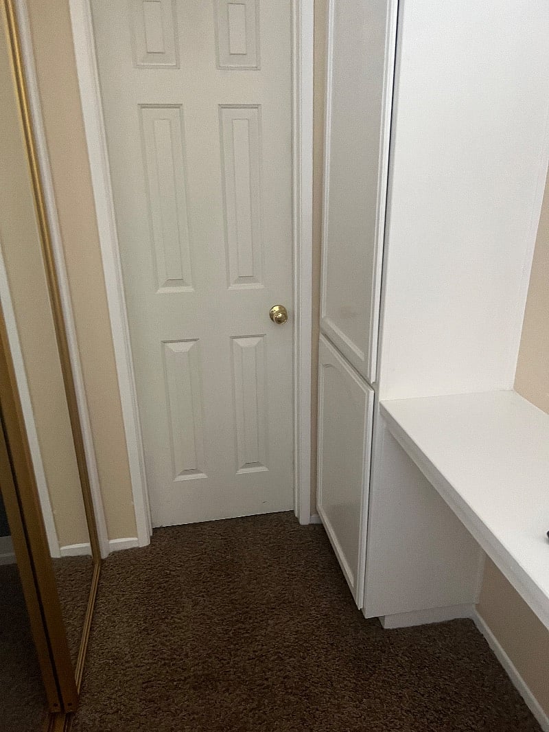 Here is the linen closet and door to jack and jill bathroom. Bathroom has a jacuzzi tub.