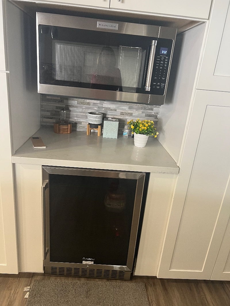 Microwave with beverage refrigerator.