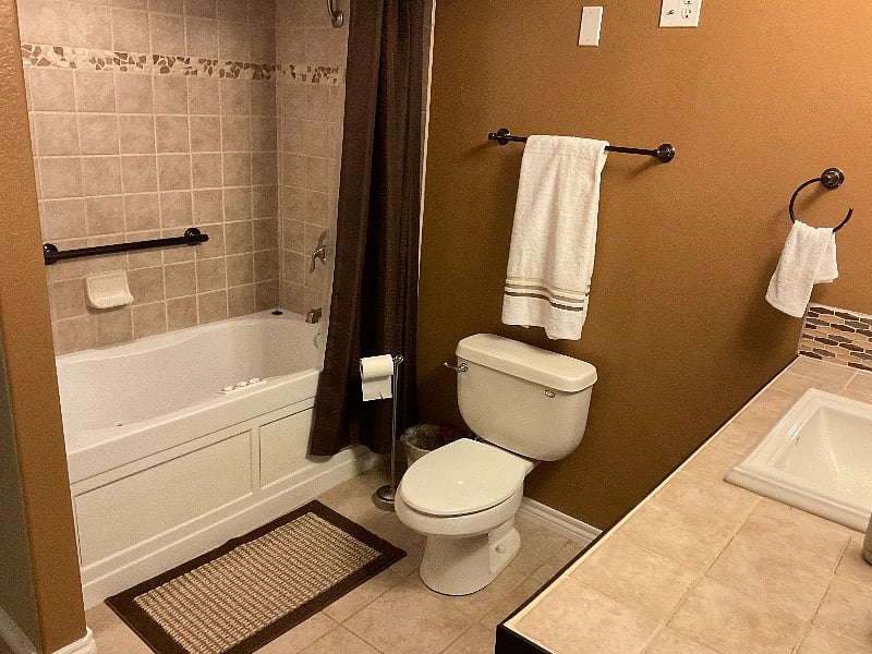 Bathroom with shower and jetted bathtub.  Large closet.