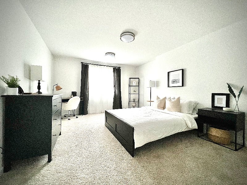 5th bedroom of secondary suite on lower floor with desk