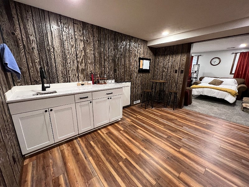 Open bar/kitchenette on lower level.