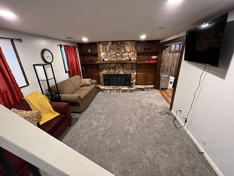 Lower Lounge relaxing area with electric fireplace.