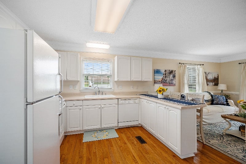 Kitchen view showing, full-size sink and full-size dishwasher