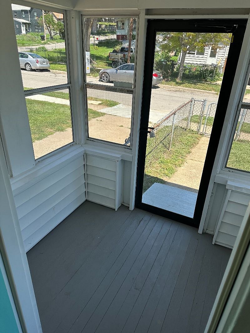 Spend some time on the enclosed front porch.