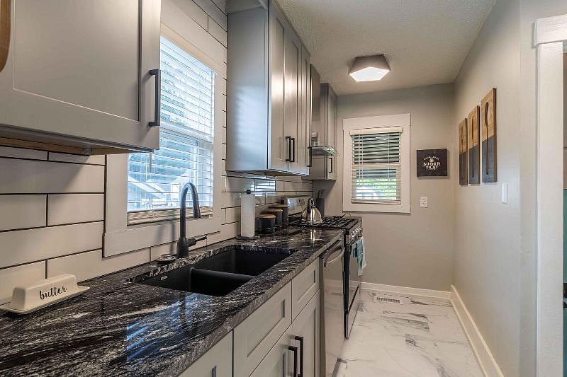 Prepare meals for friends on the modern gas range/oven.