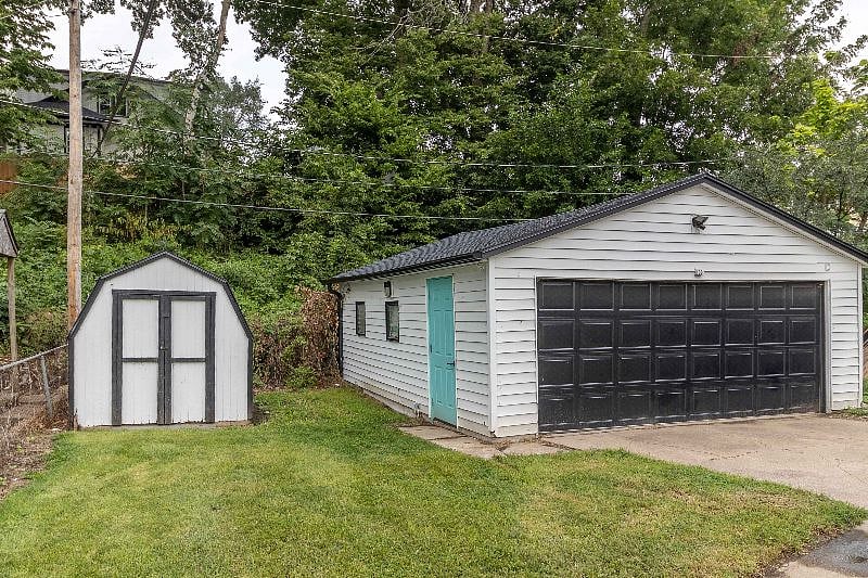 A two car garage with opener lets you keep your cars protected. Throw your bikes in the shed for your day off