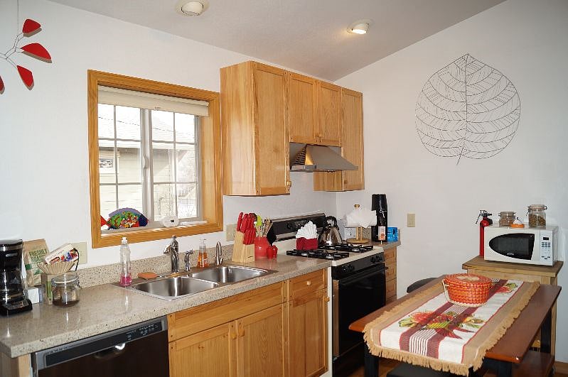 Kitchen area with full sized gas range