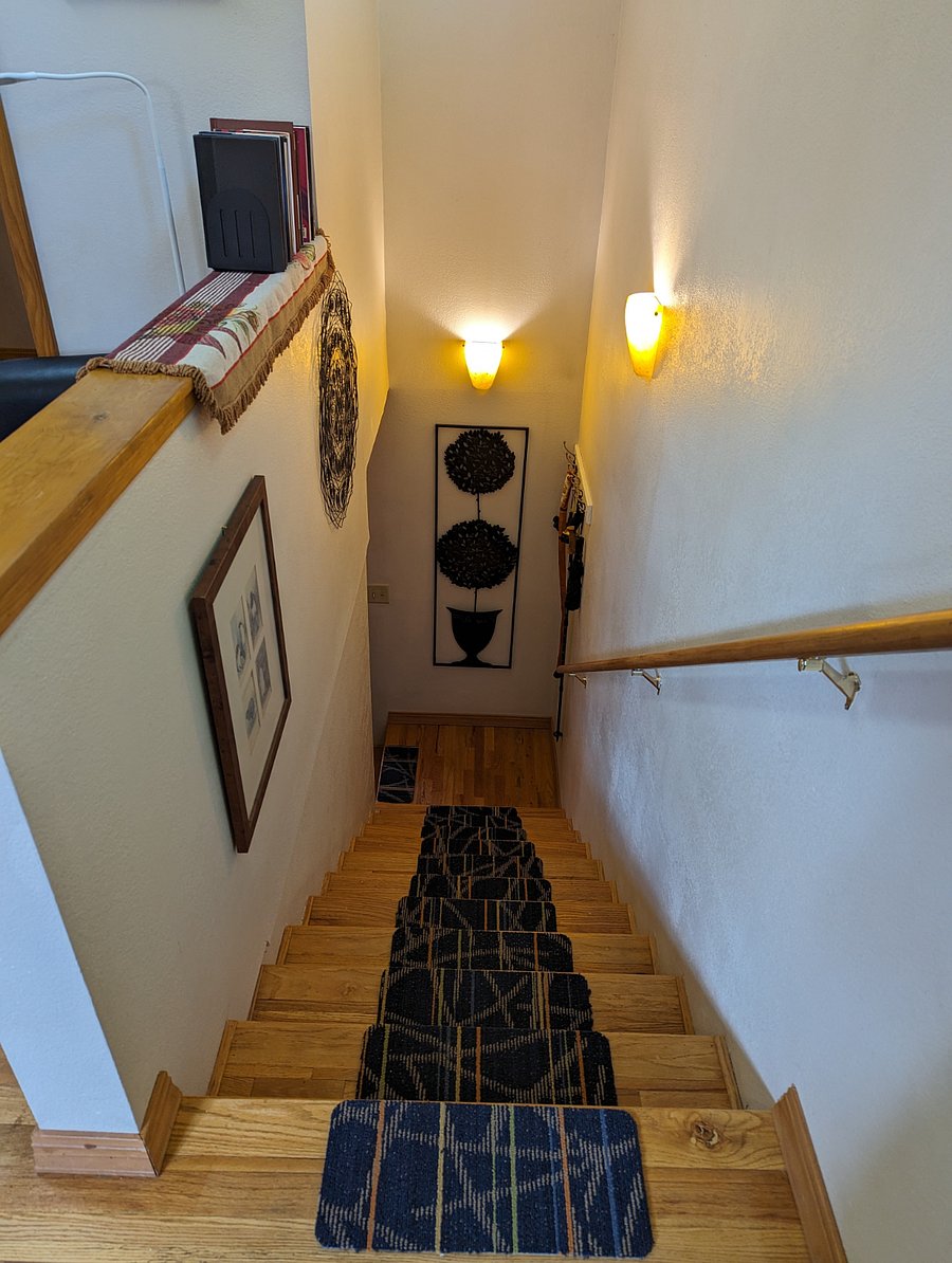 Stairwell leading down to laundry room and private entrance