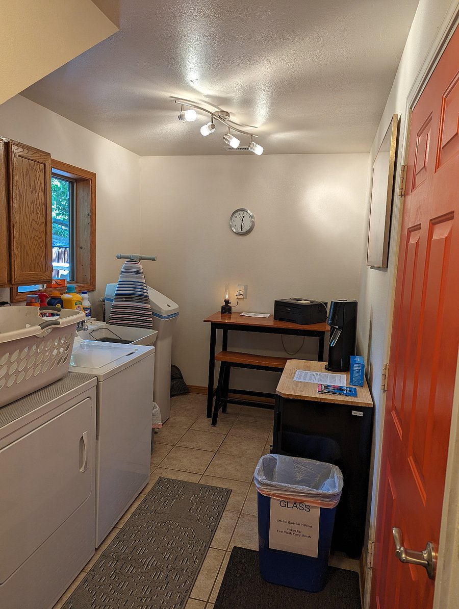 Laundry room with desk and water softener
