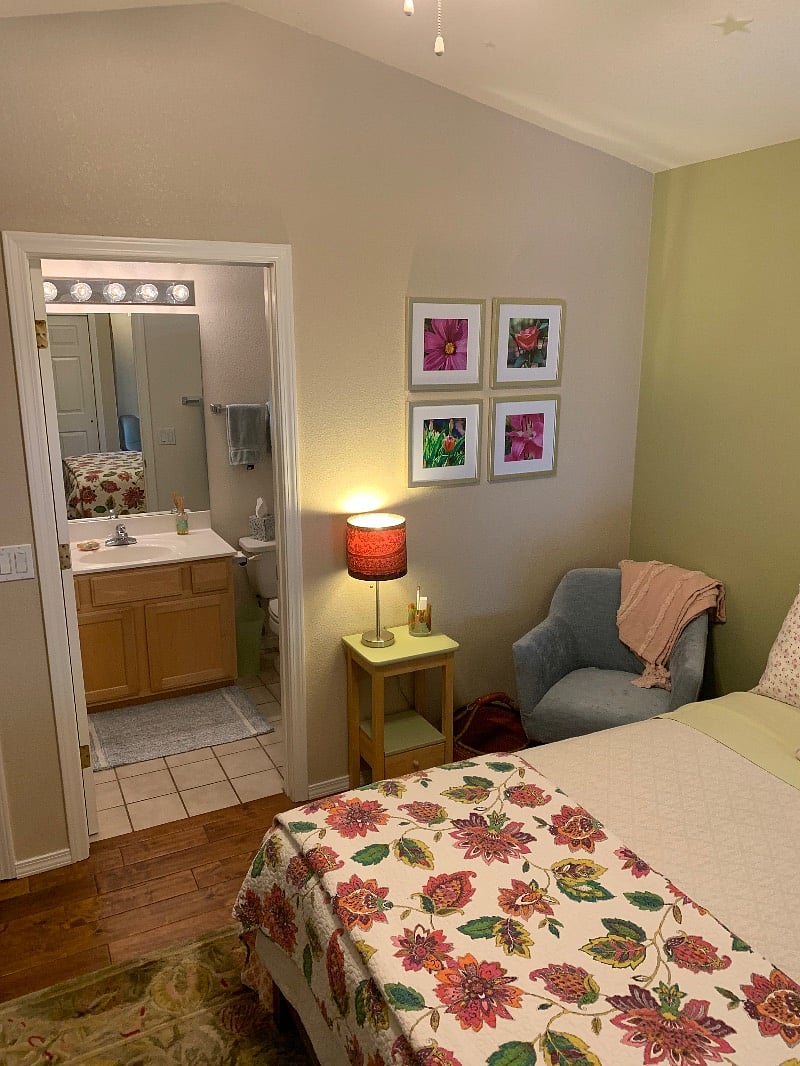 Multiple lounging spaces and adjacent bathroom. 