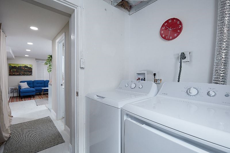 Washer/dryer and storage area.