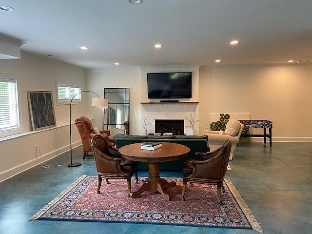 Beautiful living space for relaxing and dining. Leather and Ratan dining chairs on casters, all comfort.