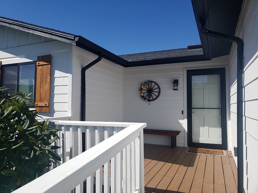 Front Porch with ramp to new screened storm doors for sunlight and ocean breezes (without flies). This home has ADA features.
