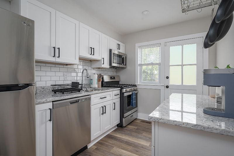 Enjoy the newly renovated kitchen which includes a dishwasher, microwave and gas range.