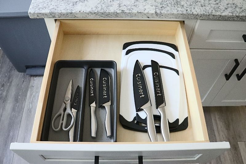 Utensils, knives, kitchen shears, cutting boards.