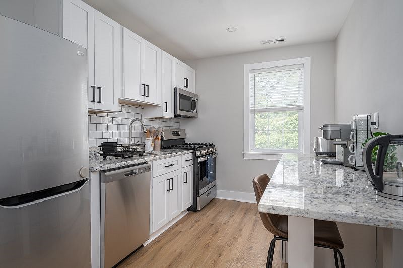 Enjoy the newly renovated kitchen which includes a dishwasher and gas range.