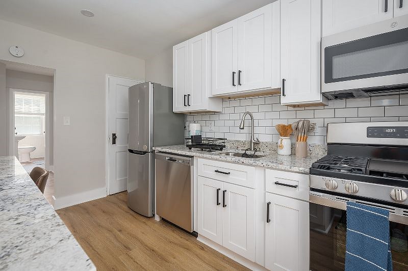 There's plenty of space in the kitchen which includes a pantry next to the fridge to store your food.