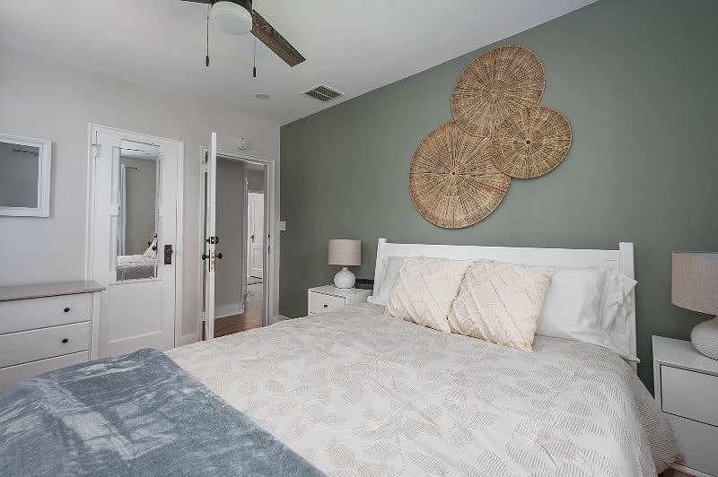 Ceiling fan above the bed to keep you cool.