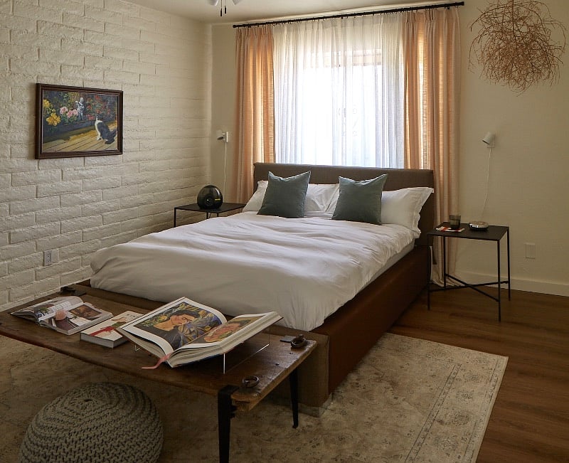 Guest bedroom with queen bed and a walk in closet