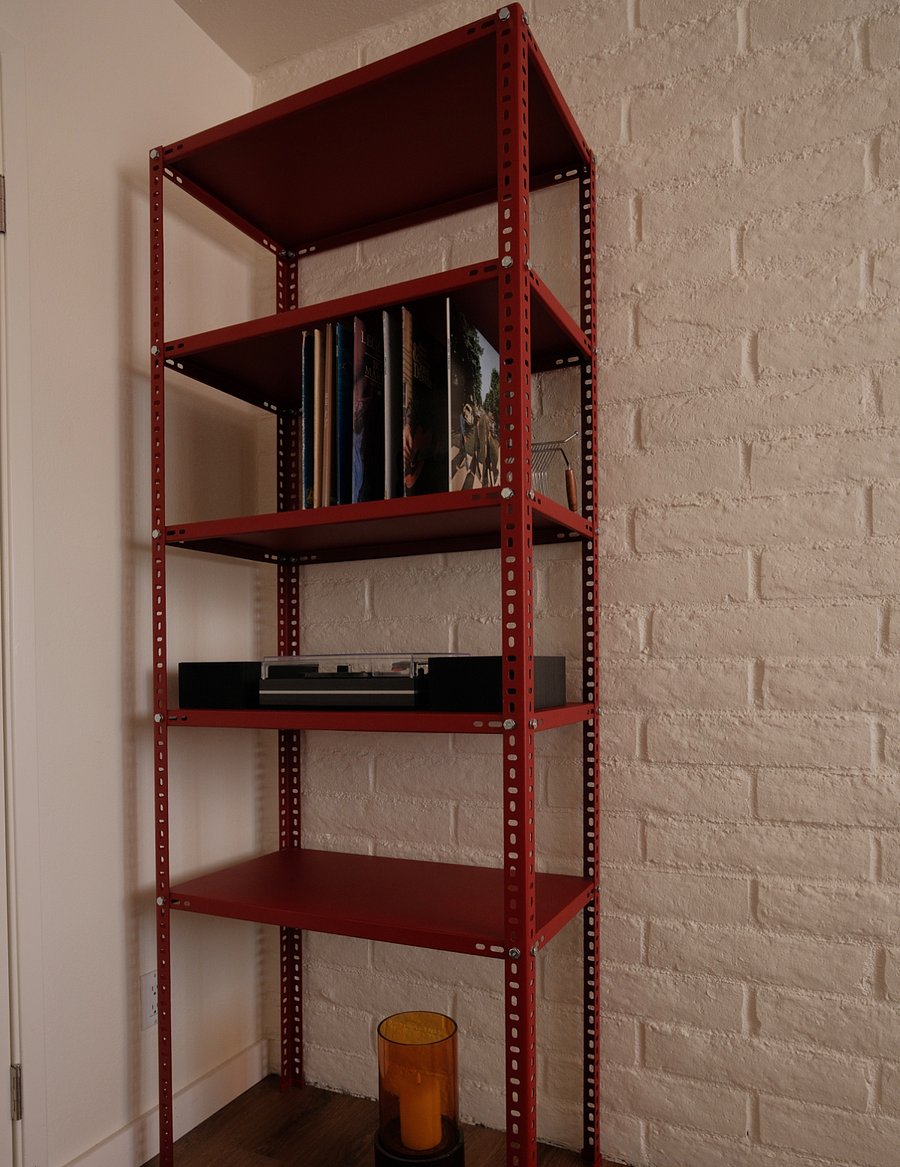 Record player in guest bedroom next to decent size walk-in closet.