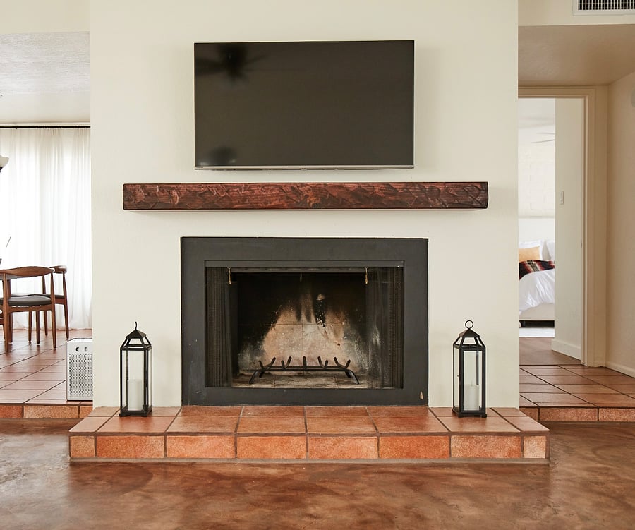 Cozy fireplace in living room. TV moved to the other side of living room as other photos shows.