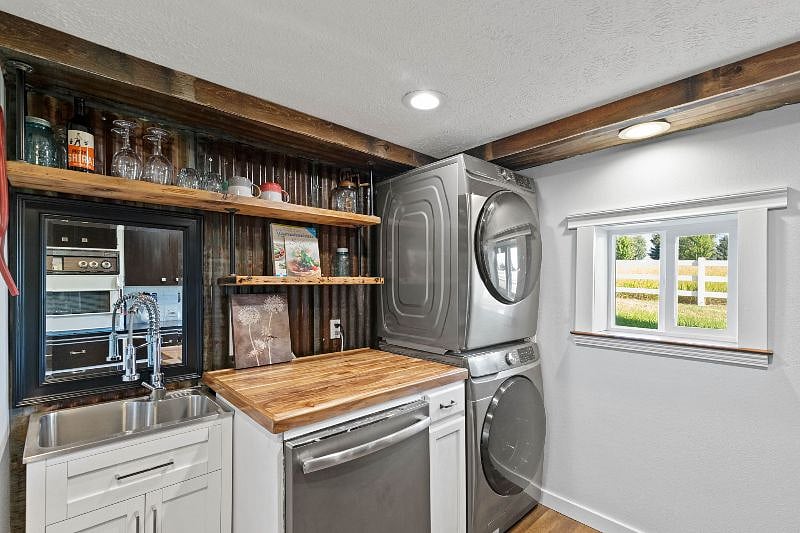Kitchen / Laundry room with dishwasher and small stove.