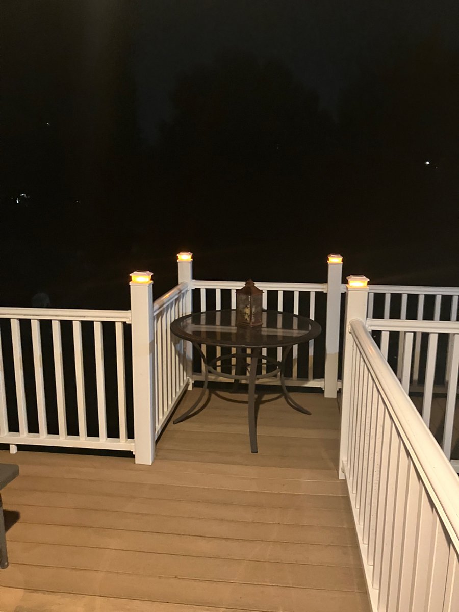 Balcony at night with post lights