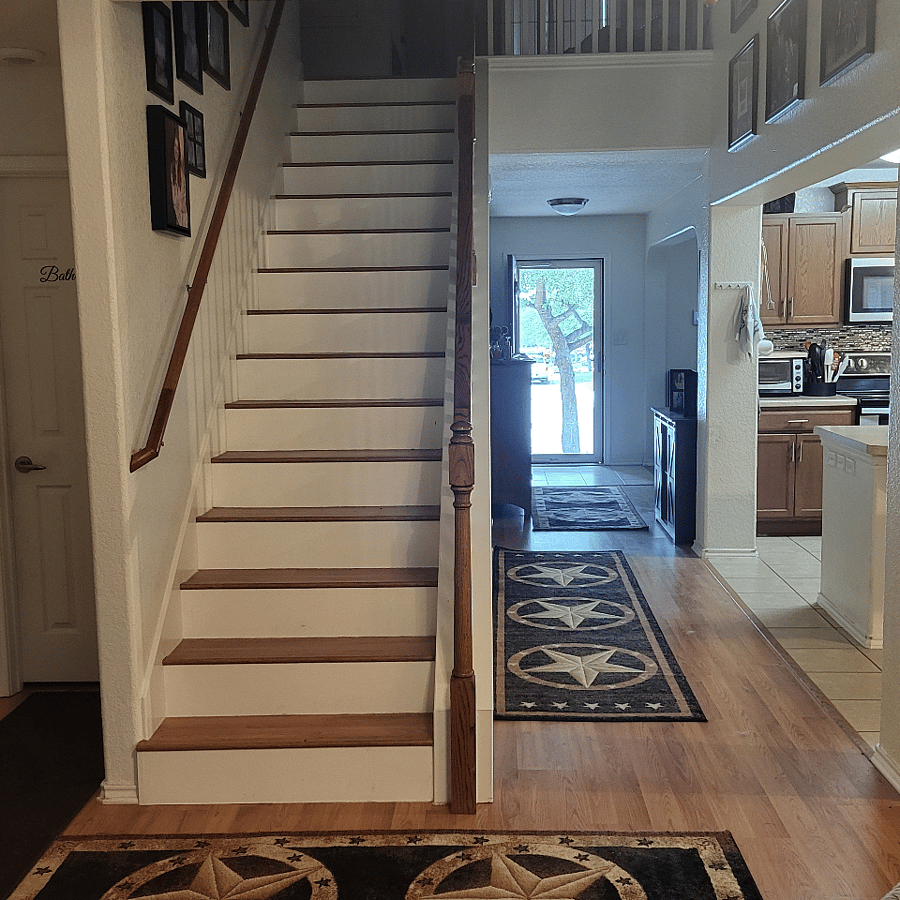 stairs leading up to private room/bathroom and bonus room/kitchenette